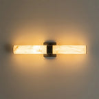 Linear LED wall light with a veined shade, lit horizontally