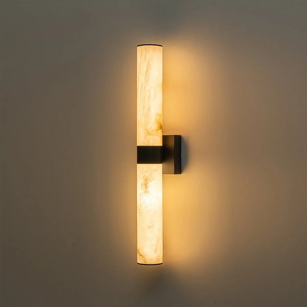Linear LED wall light with a veined shade, lit upright