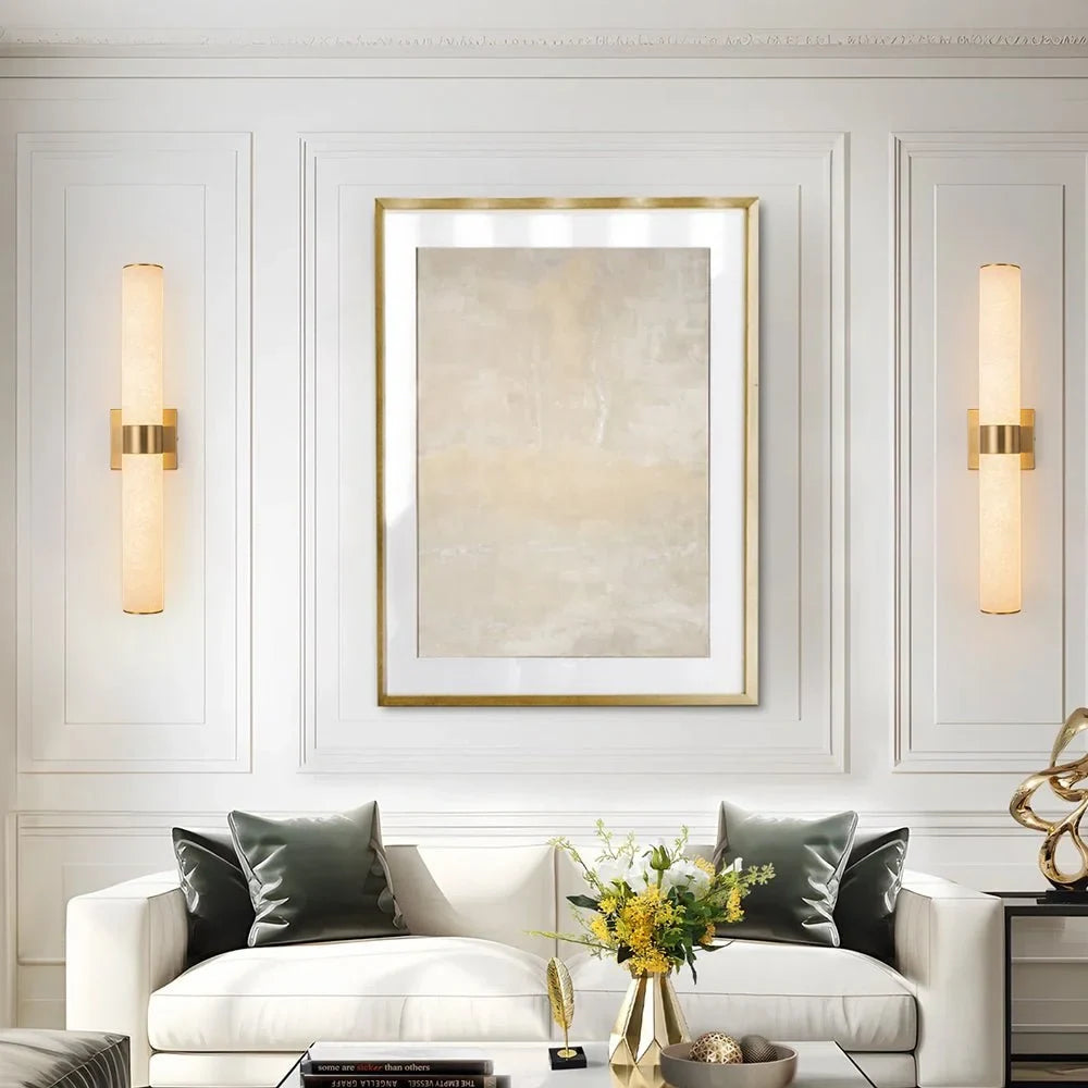 Linear LED wall light with a veined shade, either side of a picture