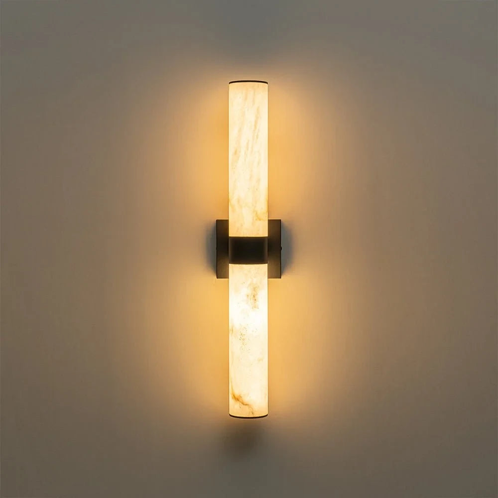 Linear LED wall light with a veined shade, lit upright