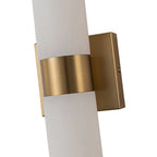 Linear LED wall light with a veined shade, brass bracket close-up
