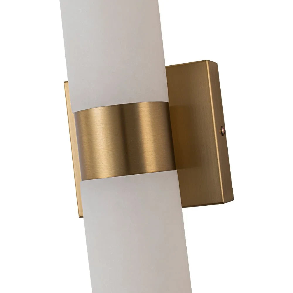 Linear LED wall light with a veined shade, brass bracket close-up