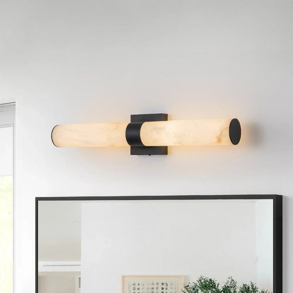 Linear LED wall light with a veined shade, horizontal, above a mirror