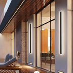 Linear outdoor wall light with a clear edge, lit on an outside wall