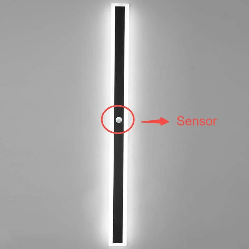 Linear outdoor wall light with a clear edge, showing the motion sensor