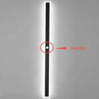 Linear outdoor wall light with a clear edge, showing the motion sensor