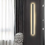 Linear outdoor wall light with a clear edge, lit on an outside wall