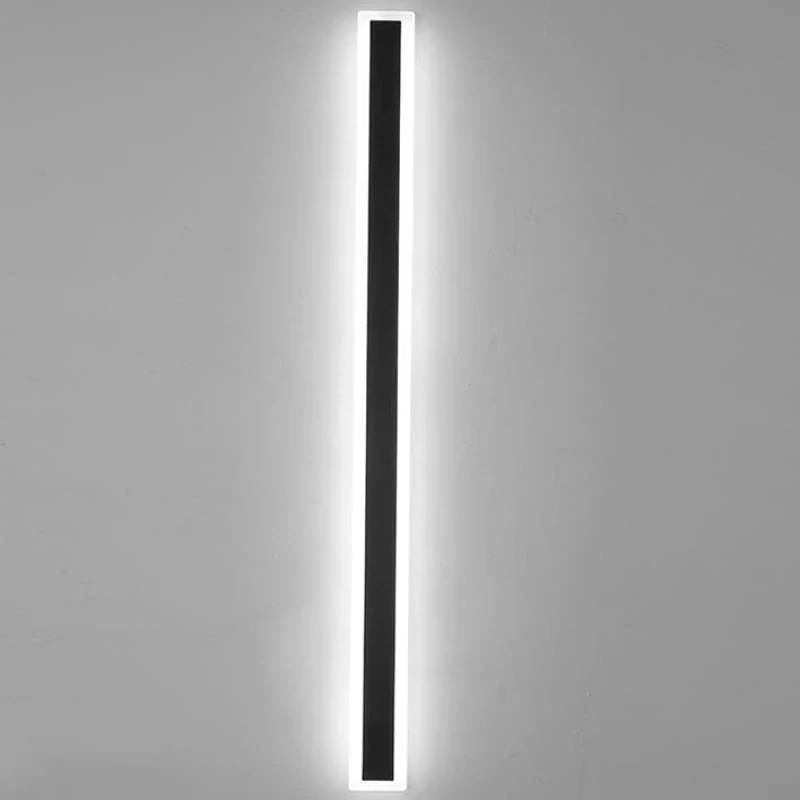 Linear outdoor wall light with a clear edge, lit