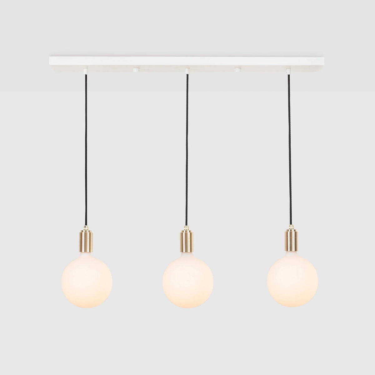 Linear triple opal globe pendant, on a white background
