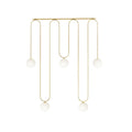 Long looping pendant with five white globes at staggered heights, in brushed brass