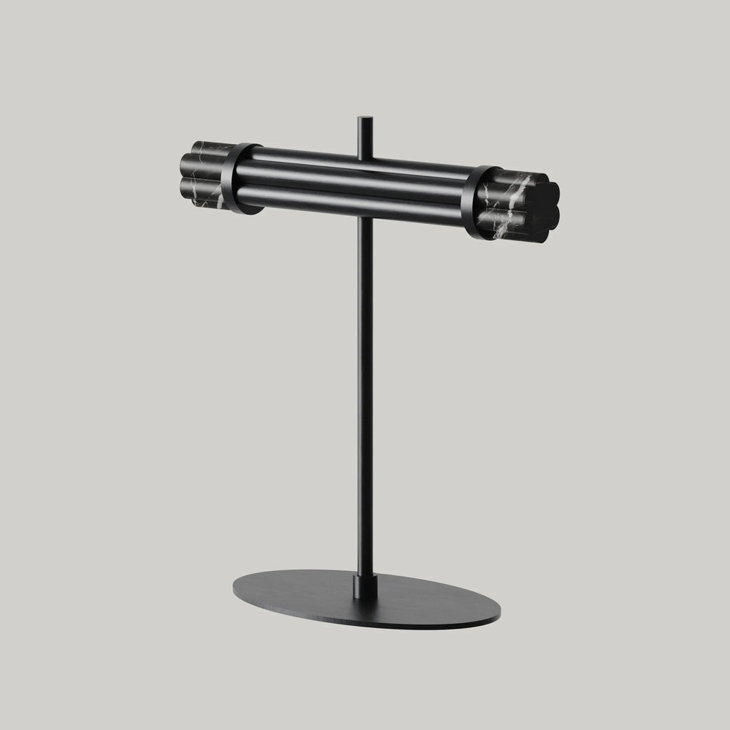 Marble bar LED table lamp with oval base, in matte black, on a plain background
