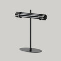 Marble bar LED table lamp with oval base, in matte black, on a plain background