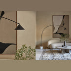 Arc floor lamp with marble base and swivel head, close-up of the head, with the lamp in a living room