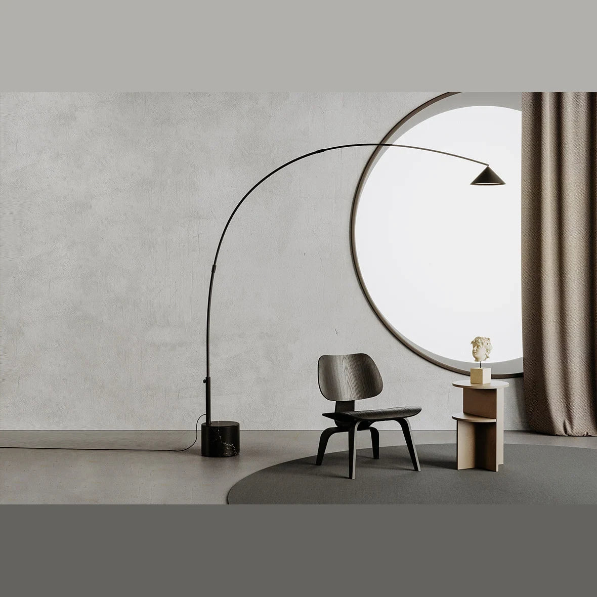 Arc floor lamp with marble base and swivel head, beside a lounge chair in a living room
