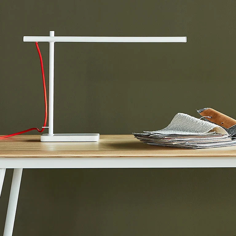 Slim task table lamp with marble base, matte white, on a desk