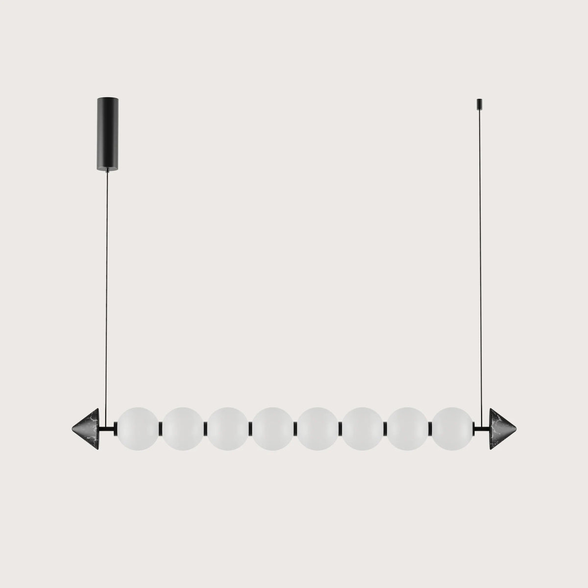 Marble bead linear LED pendant, on a plain background