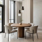 Marble, ceramic and striped glass pendant, above a round dining table