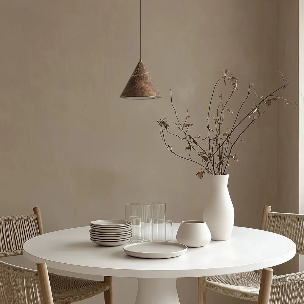 Marble cone LED pendant, above a round dining table