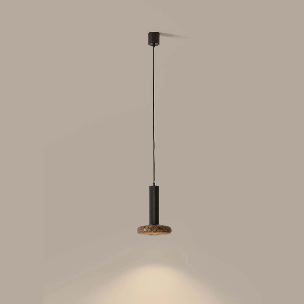 Marble disc cylinder pendant, lit, casting light below