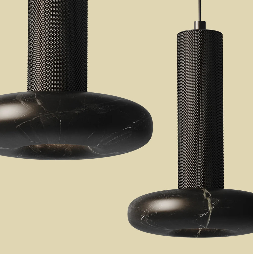 Marble disc cylinder pendant, close-up with black marble
