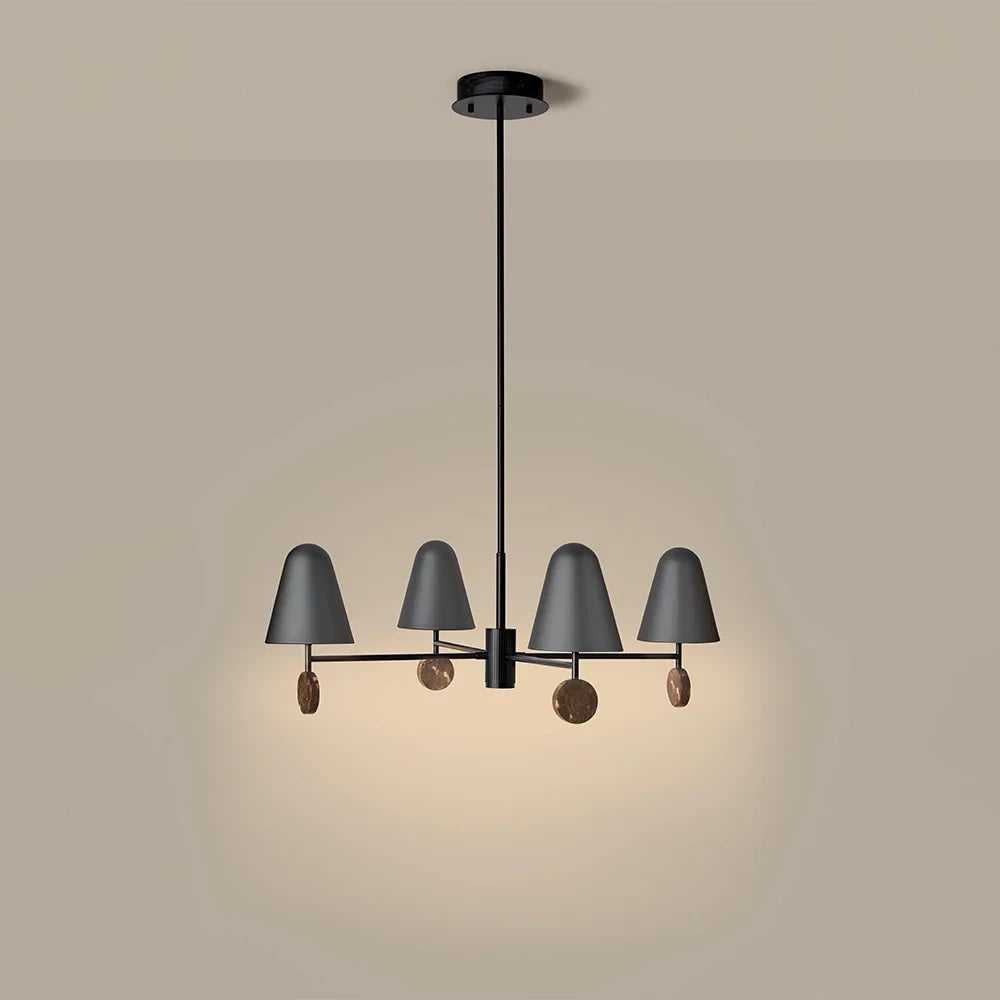 Marble disc four-arm LED chandelier, lit, on a plain background