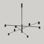 Black marble spot LED chandelier, in matt black on a plain background