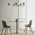 Marble sphere LED chandelier, above a round dining table