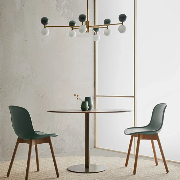 Marble sphere LED chandelier, above a round dining table