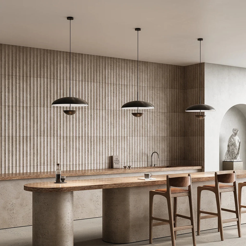 Matt black dome pendant with hanging diffuser disc, three pendants above a kitchen island