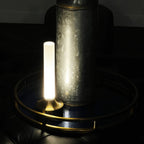Frosted column cordless table lamp, lit in a room setting