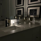 Frosted column cordless table lamp, lit in a room setting