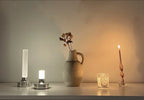 Frosted column cordless table lamp, small and large beside a vase and candles