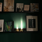 Frosted column cordless table lamp, lit in a room setting