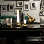 Frosted column cordless table lamp, lit in a room setting