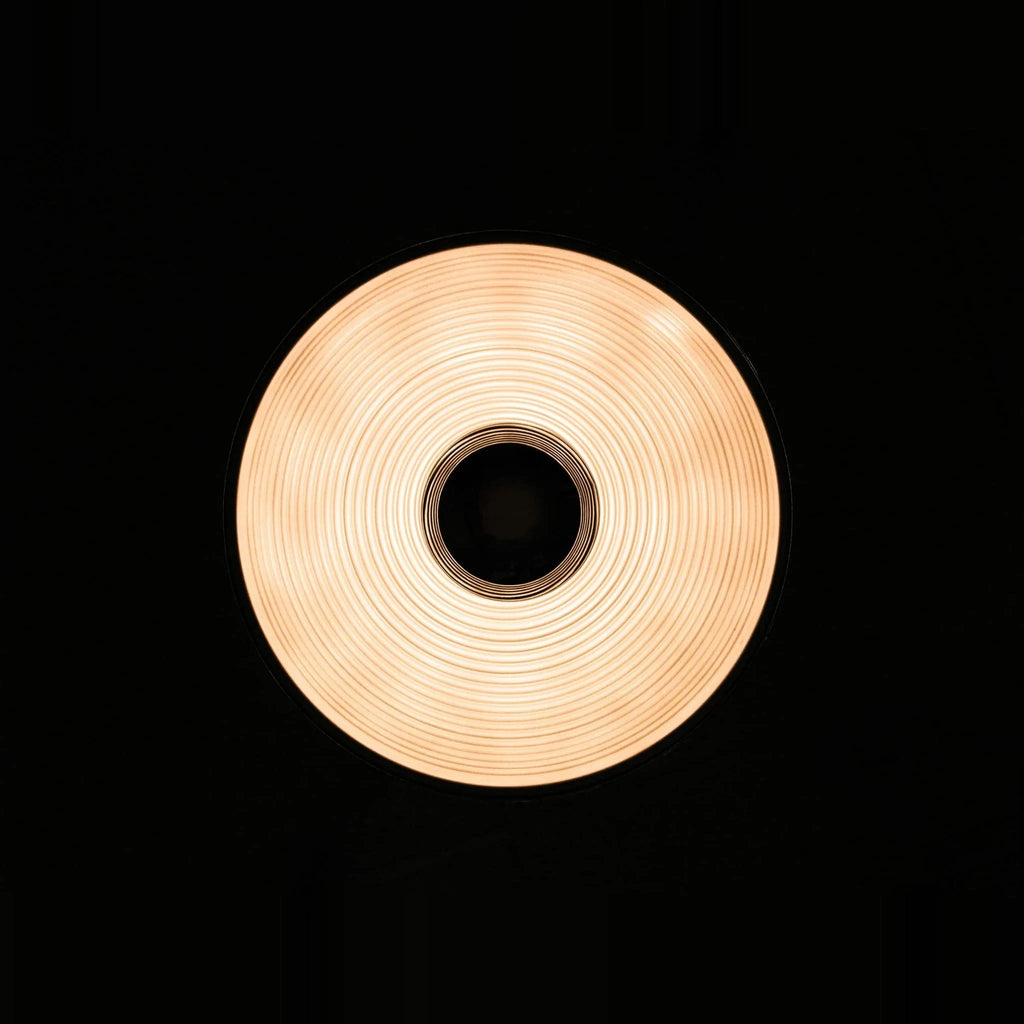 Metal dome pendant, lit, seen from below