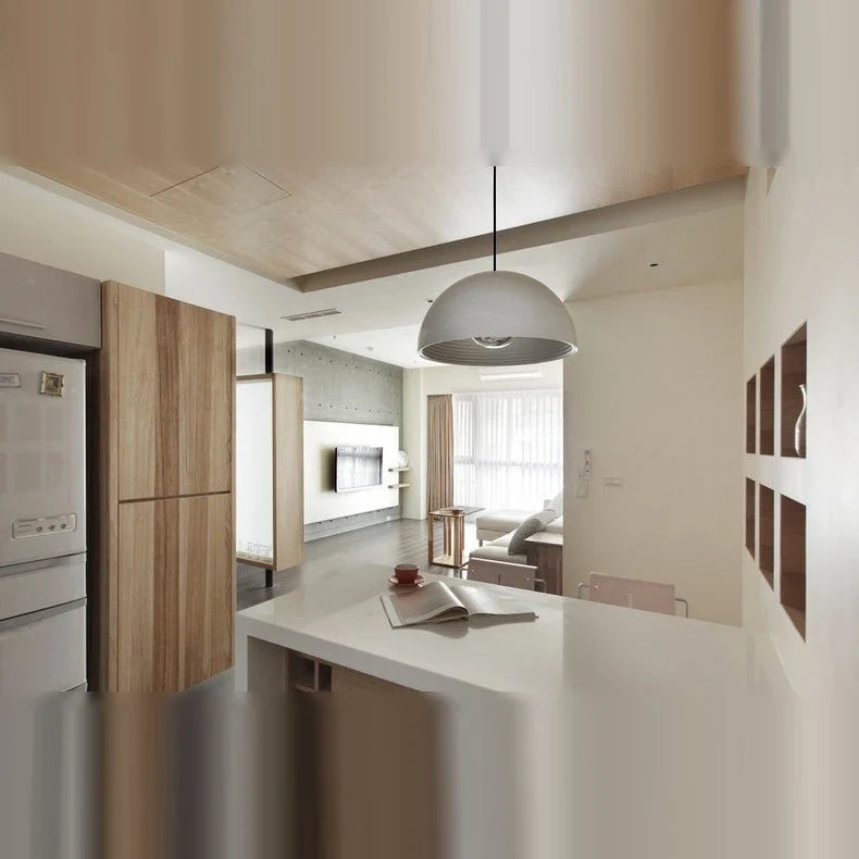 Metal dome pendant, in chrome above a kitchen