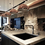 Metal dome pendant, row in copper above a kitchen island