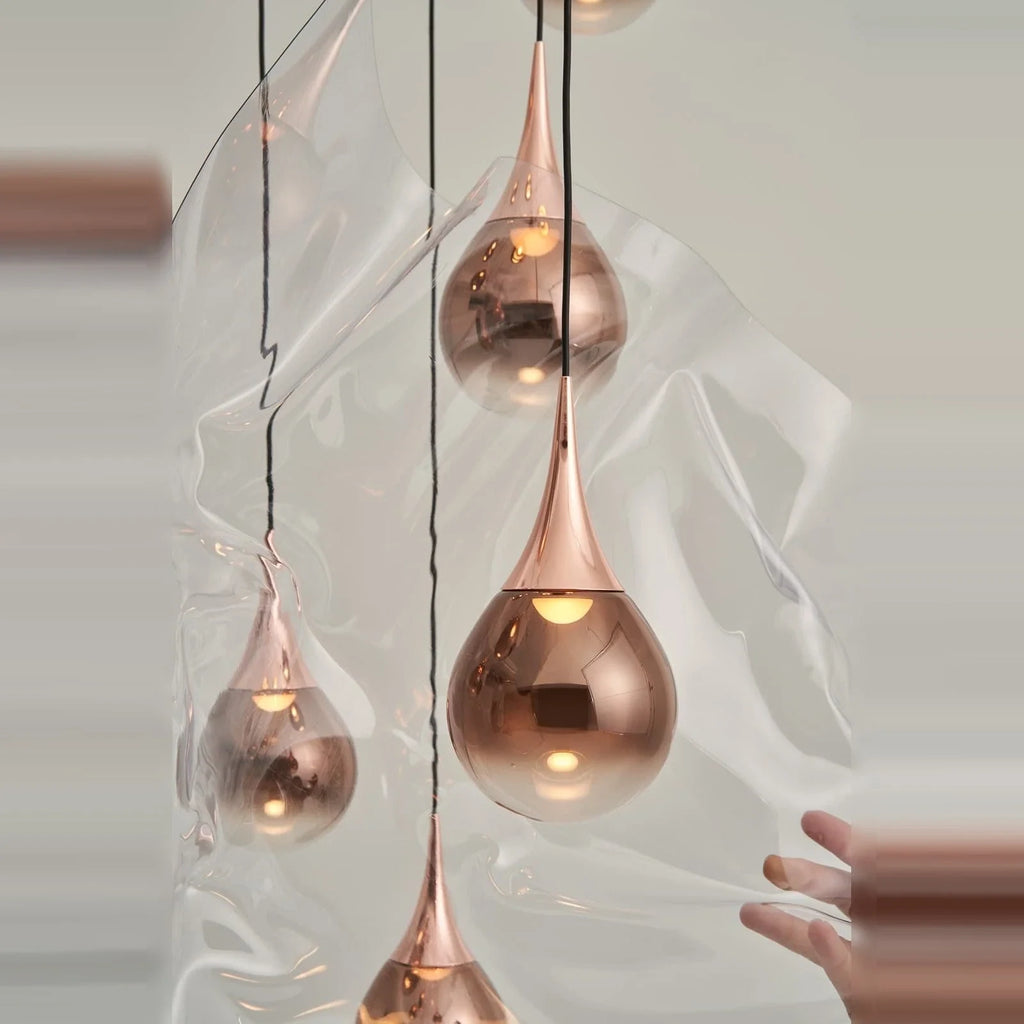 Mirrored Teardrop Five-Light Linear Pendant, close-up of copper shades