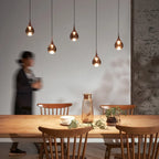 Mirrored Teardrop Five-Light Linear Pendant, above a dining table