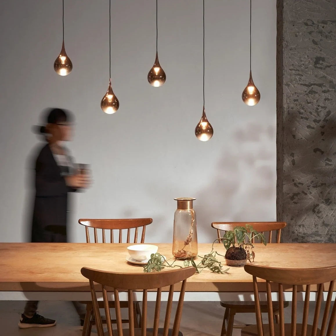 Mirrored Teardrop Five-Light Linear Pendant, above a dining table