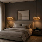 Wavy natural fibre pendant light, a pair beside a bed