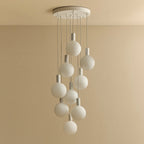 Nine-drop cluster pendant with opal globe bulbs, chalk, unlit