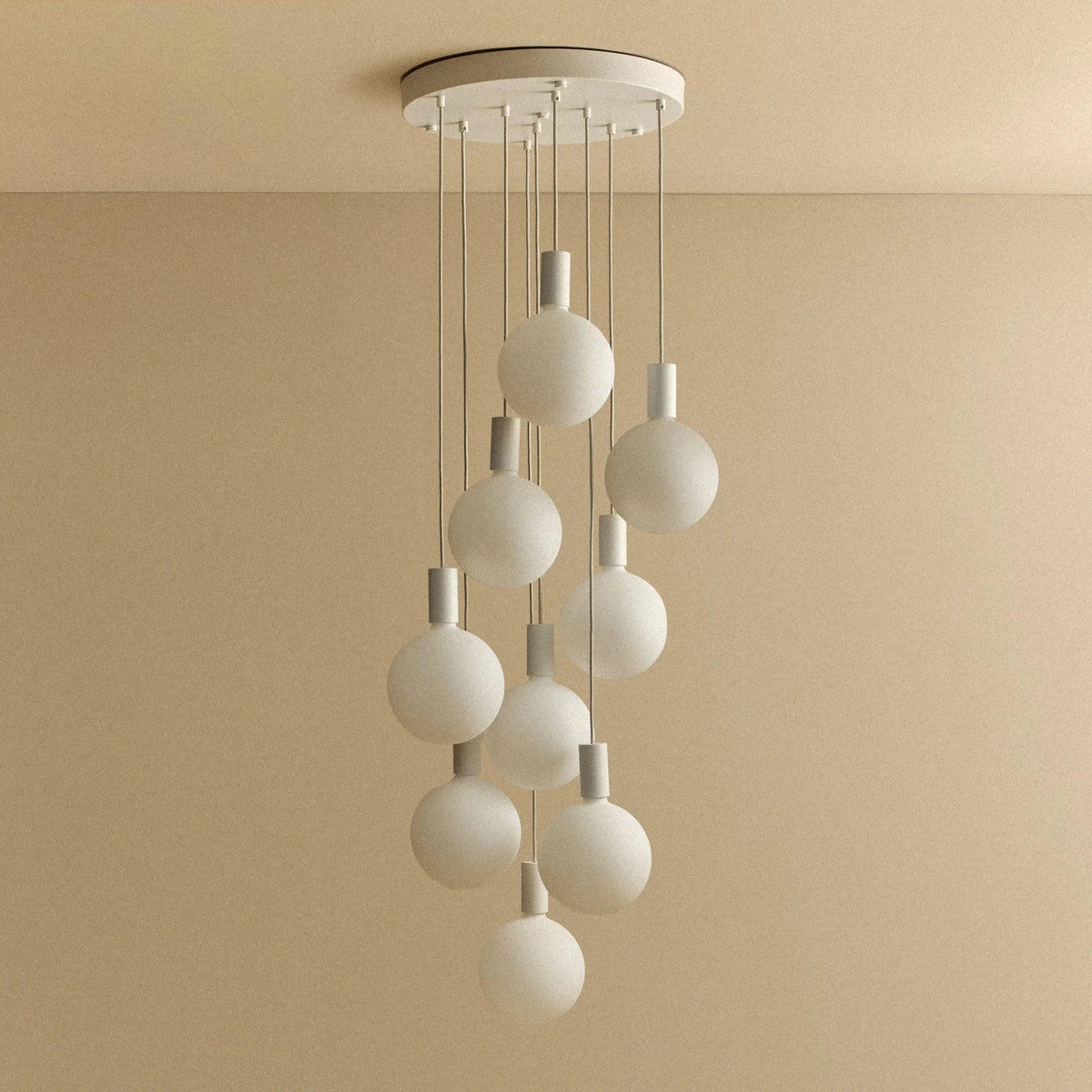Nine-drop cluster pendant with opal globe bulbs, chalk, unlit