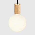 Nine-Drop Cluster Pendant, opal globe bulbs, oak, close-up of a globe on an oak holder