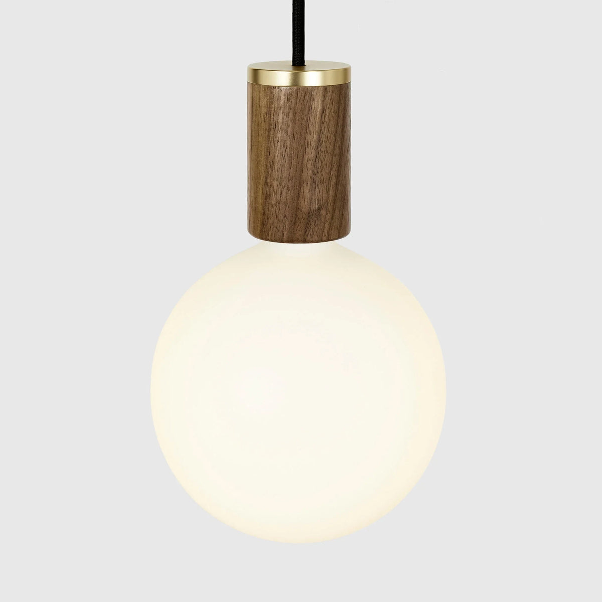 Nine-Drop Cluster Pendant, opal globe bulbs, walnut, close-up of a globe on a walnut holder