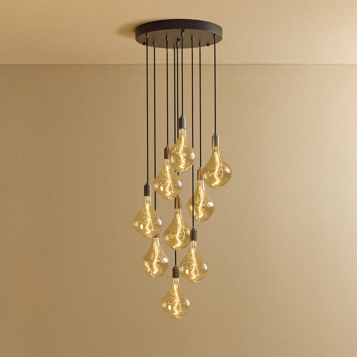 Nine-Drop Cluster Pendant, tinted sculptural bulbs, graphite, lit, nine bulbs at staggered heights