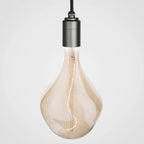 Nine-Drop Cluster Pendant, tinted sculptural bulbs, graphite, one lit tinted bulb on a graphite holder