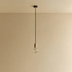 Oak cylinder pendant with filament LED bulb, against a plain wall, alternative view