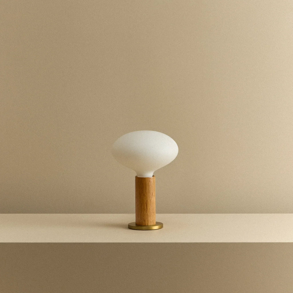 Solid oak table lamp, oval dim-to-warm bulb, unlit, on a shelf