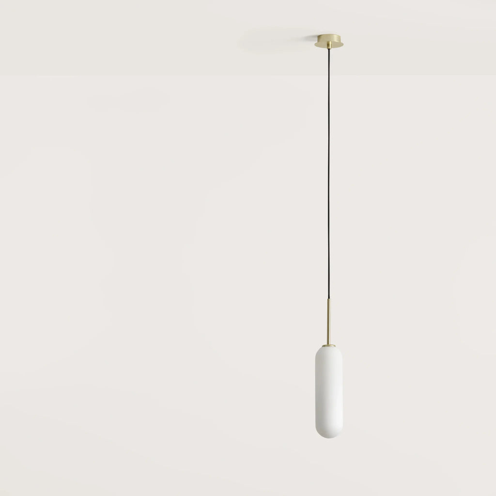 Opal glass capsule pendant, with matte brass canopy